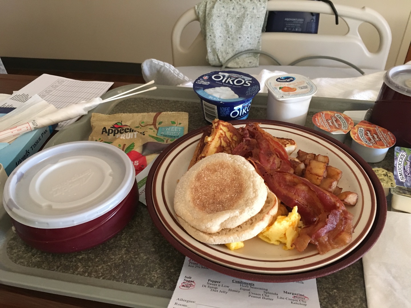 Scrambled eggs with cheese, french toast, bacon, english muffin, oatmeal, apple slices, plain greek yogurt. I didn't eat all of this, but just a little bit of each. 